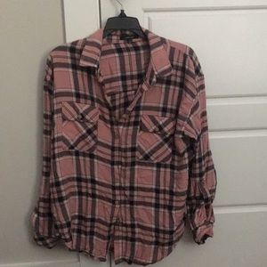 The brand is ambience is a size medium and it is pink with a hint of orange